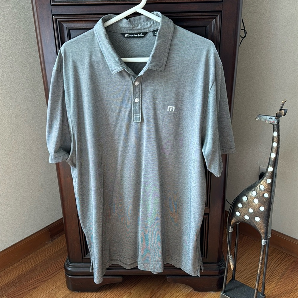 Travis Matthew XL black and white stripped polo shirt.